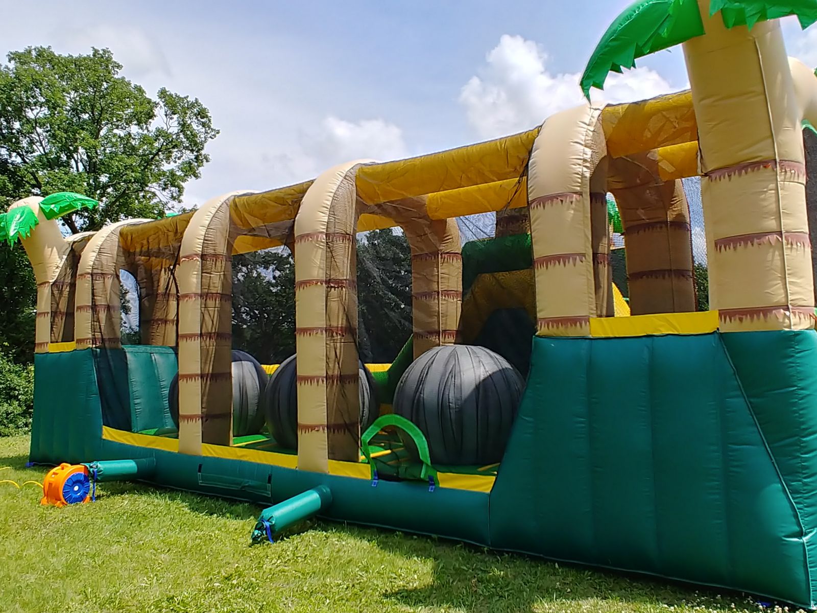 Giant inflatable ball challenge inside Hop N' Rock Obstacle Course